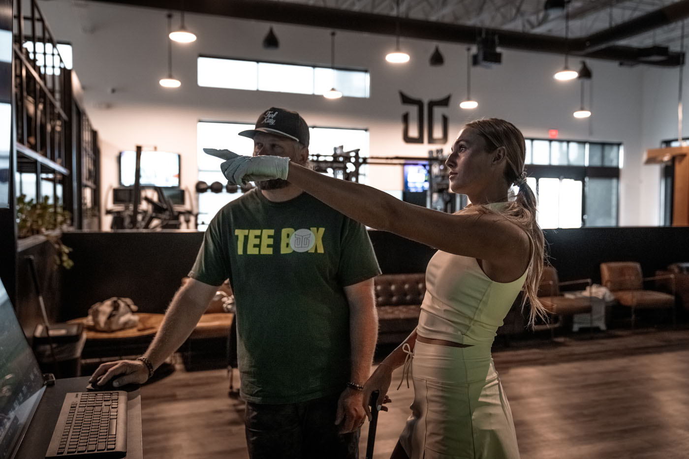 A Tee Box coach and client at our facility in Fort Lauderdale, FL.