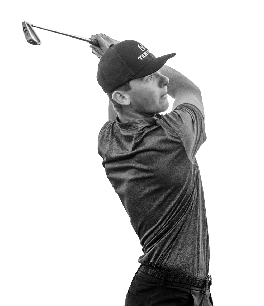 An image of a Tee Box golfer practicing at our indoor driving range.