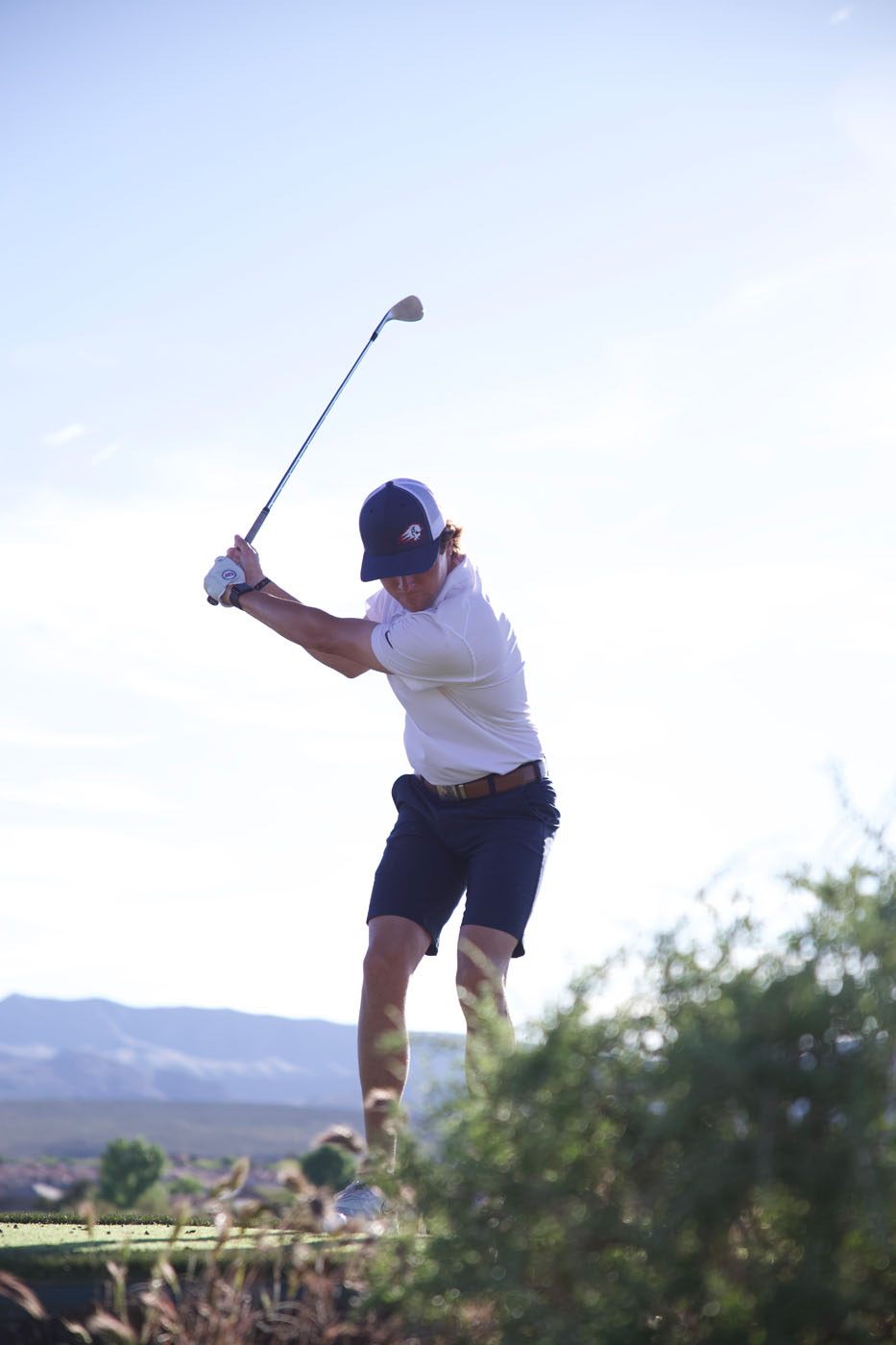 A golfer on our outside golf course - find the best St. George golf swing coaches at Tee Box.