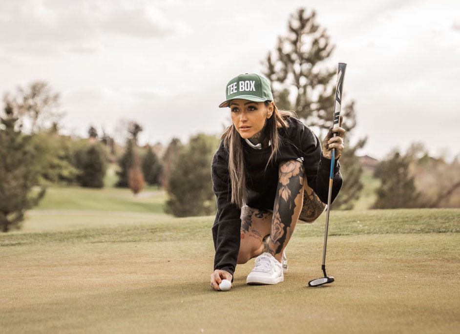 An image of golfer Taylor Nicole lining up a shot on a green in Georgetown, TX.