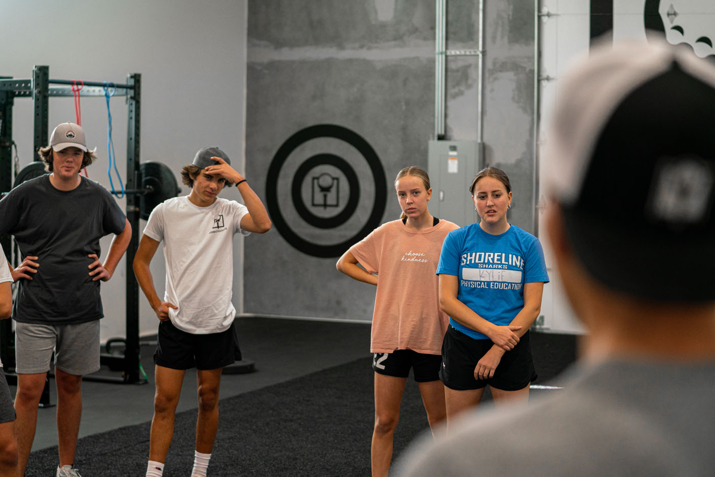 A group of young adults participating in Tee Box's golf workouts.