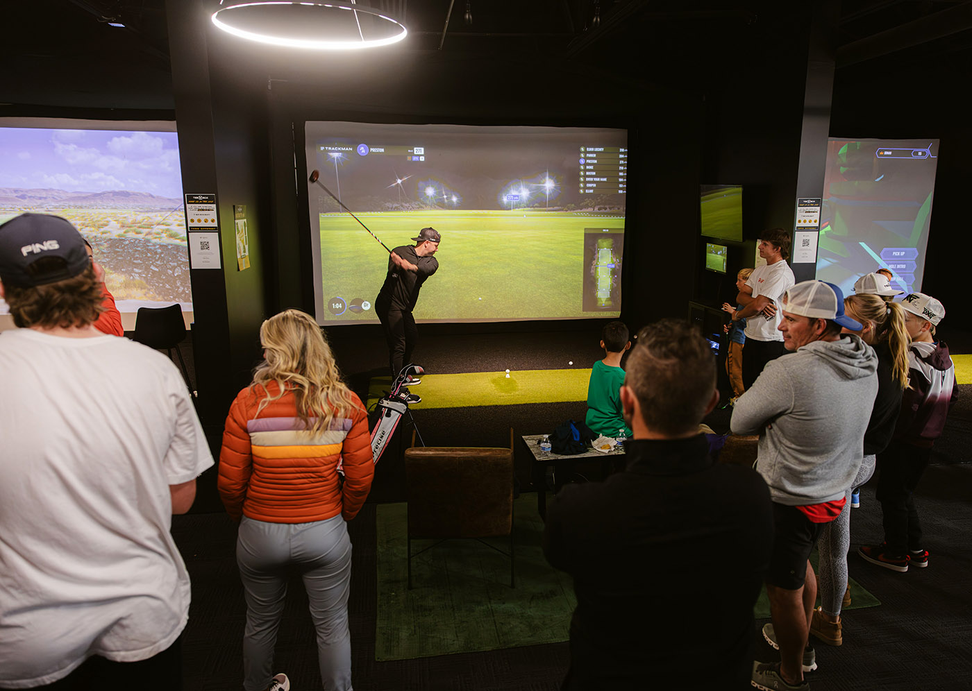 A group party at Tee Box having fun playing our indoor virtual golf simulator in St. George, UT.